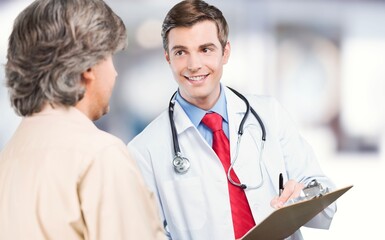 Medicine, healthcare concept - doctor talking to patient
