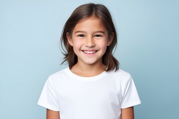 Portrait of a happy young fictional child smiling. Little girl wearing a white blank t-shirt. Isolated on a plain colored background. Generative AI.