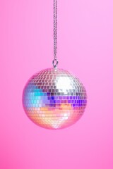  Disco or mirror ball with rainbow on pastel light pink and purple background. Music and dance party background. Trendy party symbol. Abstract retro 80s and 90s concept
