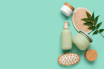 Set of cosmetic products and bath items on color background