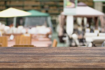 Empty blank wood table with bar interior background.