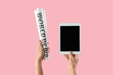 Woman with blank tablet computer and newspaper on pink background - obrazy, fototapety, plakaty