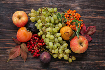 Different fresh fruits on wooden background