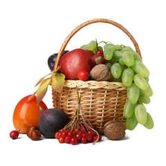 Wicker basket with different fresh fruits on white background