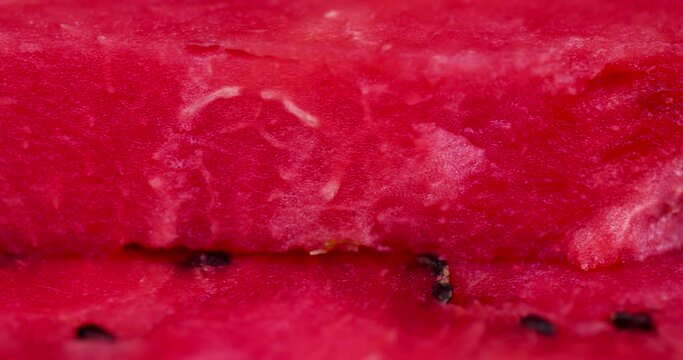 red ripe watermelon on the table, cut into pieces red ripe and juicy watermelon