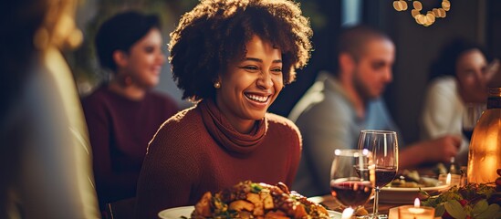 African American woman enjoying Thanksgiving meal with family and serving salad