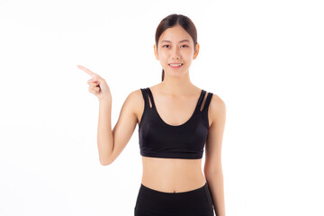 Obraz na płótnie Canvas Portrait of beautiful young asian woman in sportswear smile and presenting isolated on white background, sport and exercise for health and weightloss, female and slimming showing something.