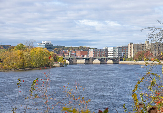 A view of the Haverhill skyline of the bridge and tall modern buildings. This small city in New England is brick and glass buildings. Haverhill Massachusetts MA during the fall and autumn with leaves