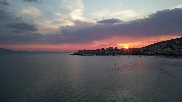 Sunset view in Sarande city Albania riviera summer colors amazing sunshine sundown places to be aerial drone footage cinematography clips high quality clips