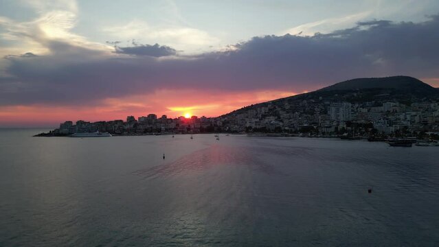 Sunset view in Sarande city Albania riviera summer colors amazing sunshine sundown places to be aerial drone footage cinematography clips high quality clips