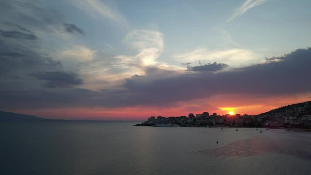 Sunset view in Sarande city Albania riviera summer colors amazing sunshine sundown places to be aerial drone footage cinematography clips high quality clips