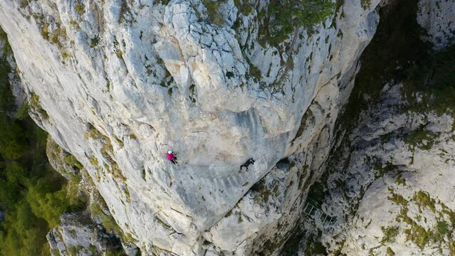 Two Female climbers mountaineering, via ferrata in "Red Rocks", Mountain Romanija in Bosnia and Herzegovina