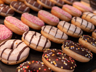 Colorful and Tempting Glazed Donuts with Festive Confetti Decor