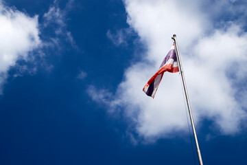 Thai flag with sky and white clouds background