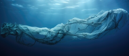 Oceanic pollution caused by discarded fishing nets - obrazy, fototapety, plakaty