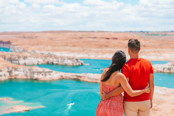 Fototapeta na wymiar Young couple enjoying the view Lake Powell, Glen Canyon National Recreation Area