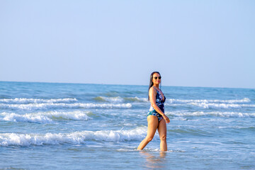 Fototapeta na wymiar Woman body big with swimsuit relax at beach