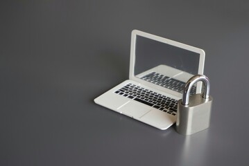 Closeup image of laptop and padlock with copy space. Cyber security concept.