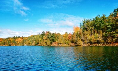 Pink Lake, Gatineau, Quebec, Canada during fall season with colorful tree