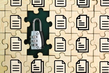 wooden puzzle with document and key icons. document security concept. DMS concept. ERP, document management concept