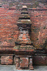 An old monument-shaped building made of brick in the royal complex in Java, Indonesia