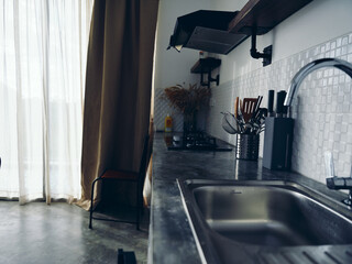 Modern kitchen sink, stylish interior.