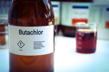 Butachlor in glass, Herbicides are used to manage wasteland or control weeds in agriculture
