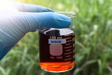 Herbicide in glass, Herbicides are used to manage wasteland or control weeds in agriculture
