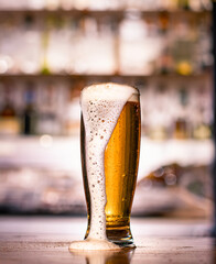 Pouring Beer Foam with Blurred Backdrop