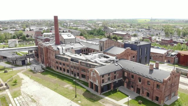Exterior View Of Sugar Factory With Smokestack - Industrial Plant In Znin, Poland. - aerial