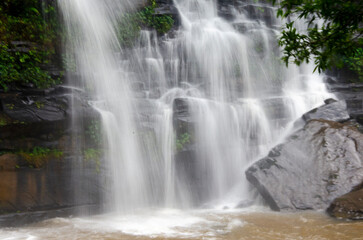Fototapeta premium Beautiful lines of white water of waterfall on cliff