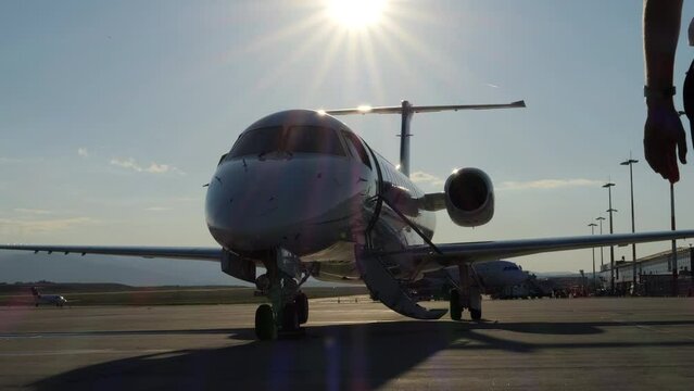 Pilot Walks Towards His Aircraft at Airport Ramp SLOMO