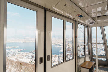 Beautiful landscape and cityscape from Hakodate Mountain ropeway with Snow in winter season....
