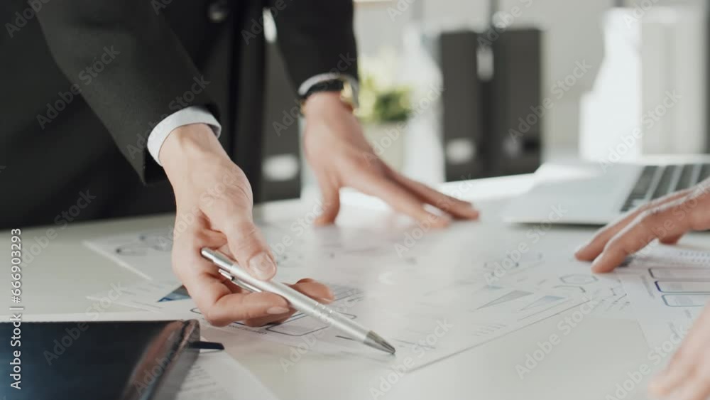 Poster close up shot of two unrecognizable business partners standing and brainstorming ideas about project