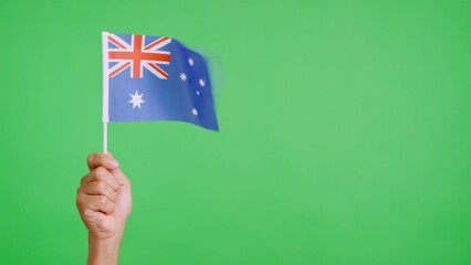 Wind waving a australian pennant holding by a person