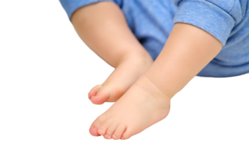 Bare feet of a child on a white warm rug, close-up, isolated on a white background. Toddler baby boy is playing lying down on the carpet in the nursery. Kid aged one year and three months