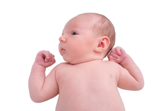 Portrait of a baby boy aged 1 month lying with his eyes open in a crib, isolated on a white background. Caucasian child in the children bedroom on the bed
