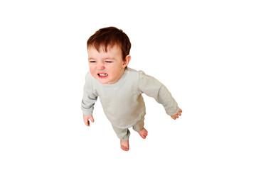 Little baby whimpers and is naughty, isolated on white background. Small child is crying and...