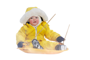 Toddler baby rides in the snow on icesled, a winter playground, isolated on white background. Mother woman sledding baby boy in yellow snowsuit. Kid age one year eight months
