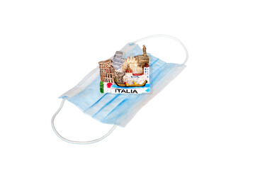 Medical mask and tourist magnet with the symbol of Italia, isolated on a white background. Signal...