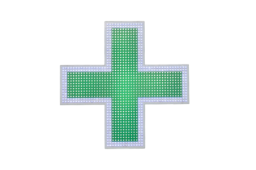 Green cross pharmacy signs on the wall of a city house, isolated on white background