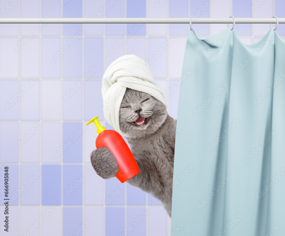Aufkleber laughing cat with towel on it head holding bottle of flea shampoo and peeking out from behind the cu