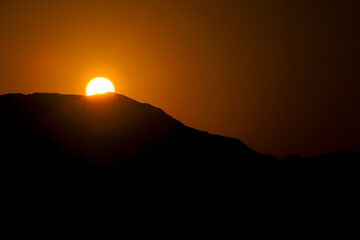 Sun rising at dawn over the mountains in Cabo de Gata, Almeria