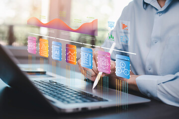 Businessman using a laptop with Analytics and Data Management Systems  Analyst working in Business...