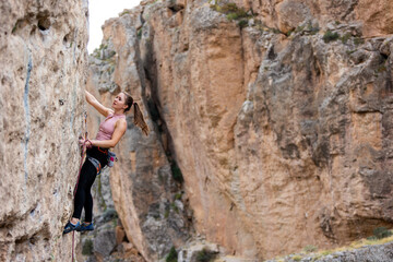 girl rock climber. sport climbing.