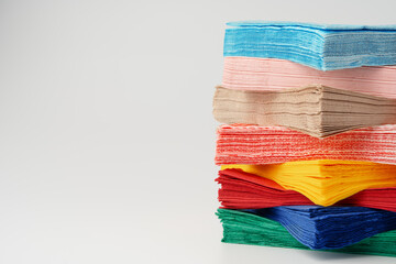 Stack of paper napkins on white background