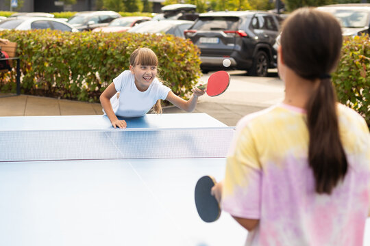 girl plays in table tennis outdoor