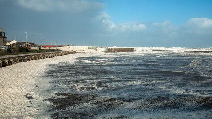 Very stormy sea creating foam - sea snow caused by storm