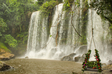 Swing at Kulen Mountain waterfall, It is the holly water