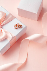 White jewelry boxes with silk ribbon close up